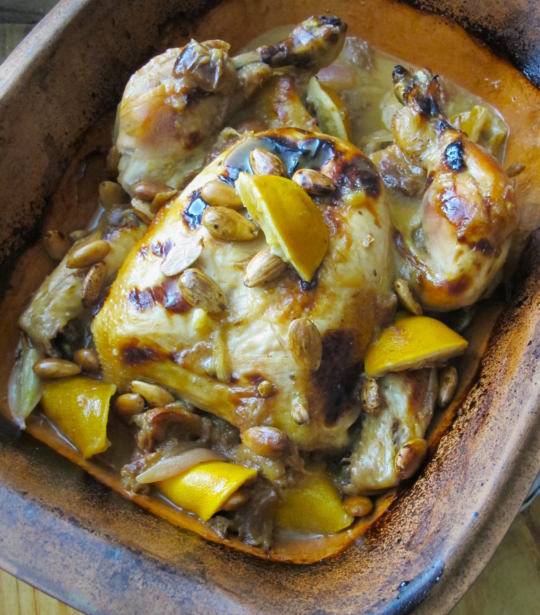 Whole Roasted Chicken in Clay Pot with Almonds, Dates and Lemons